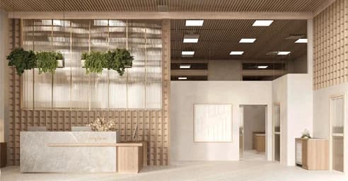 Modern reception desk beneath a slatted wood ceiling with plants.