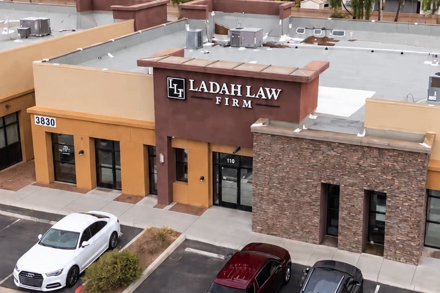 Elevated view of Ladah Law's North Las Vegas office entrance and surrounding commercial property.