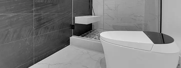 Walk-in shower remodel in Centennial Hills with contrasting tile glass enclosure shower niche and modern fixtures
