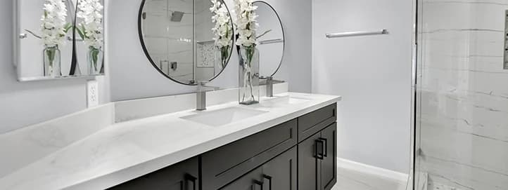 Finished bathroom remodel in Enterprise with tiled shower dark vanity and clean final detailing