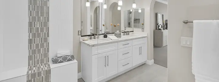 Bathroom remodel in Spring Valley with long vanity tub surround mosaic tile detail and updated lighting