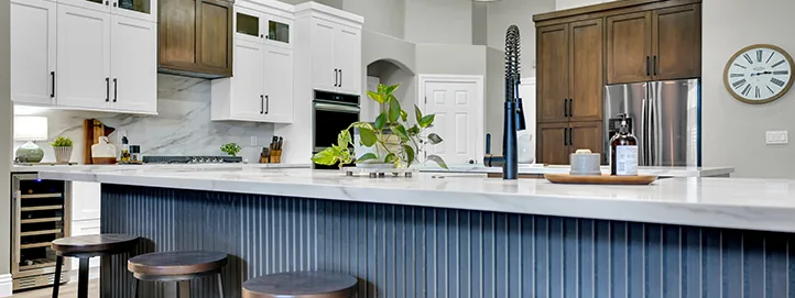 Kitchen remodel with navy blue detailing on the island in Queensridge, Las Vegas, Nevada