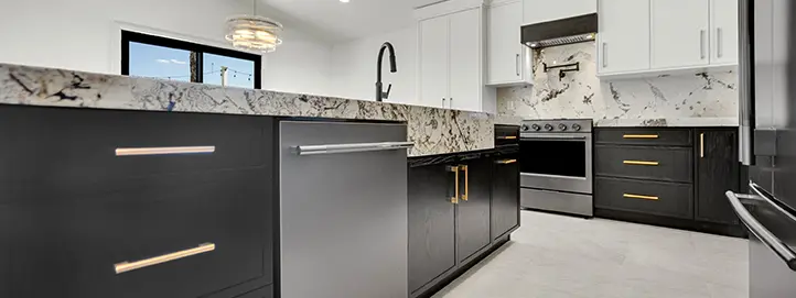 Dark kitchen island with integrated dishwasher, stone countertop, black faucet, range, and slab backsplash