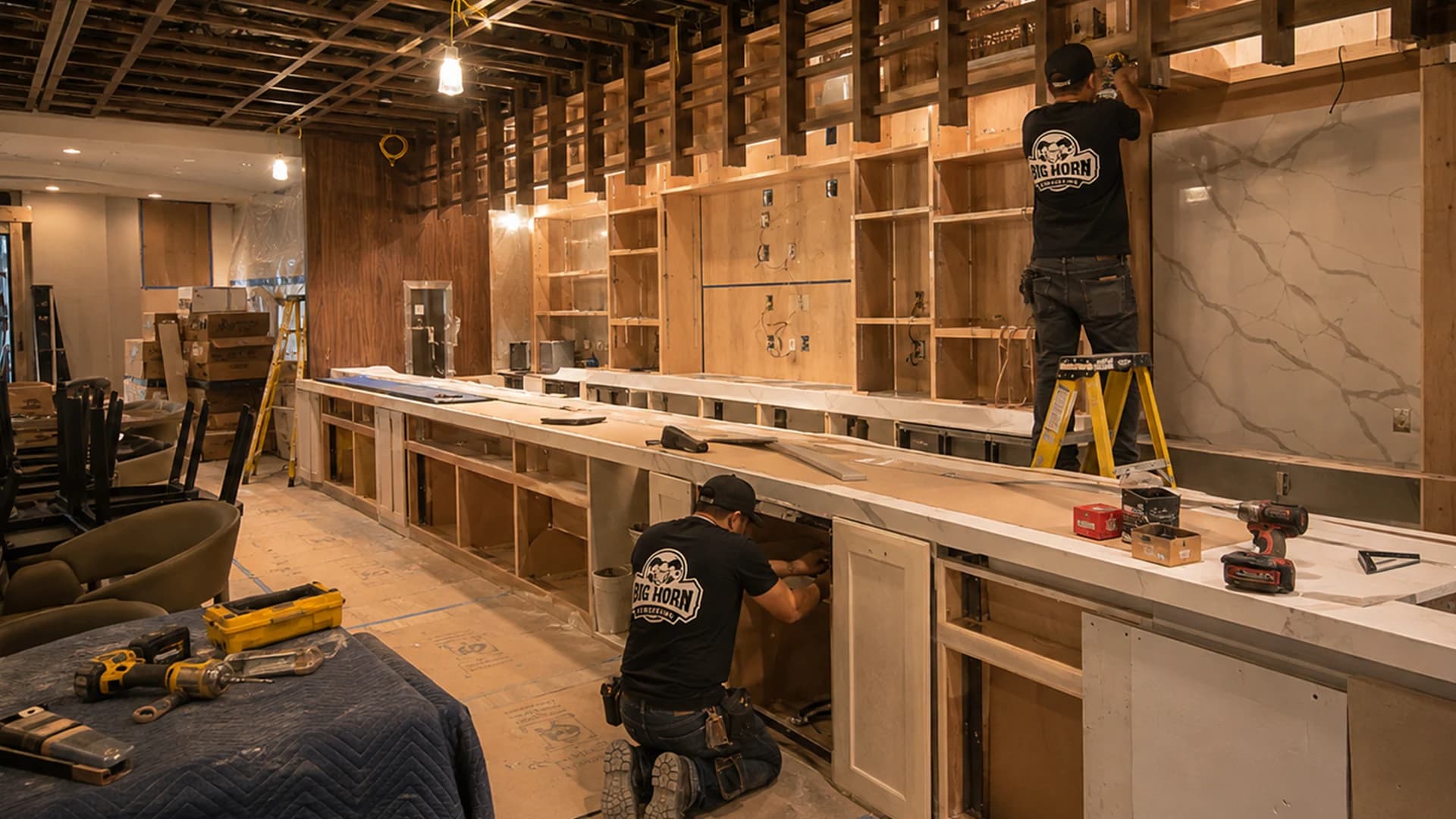 Big Horn Remodeling crew installs a service counter and wall millwork inside a restaurant buildout.