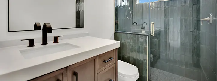 Walk-in shower remodel in Centennial Hills with contrasting tile glass enclosure shower niche and modern fixtures