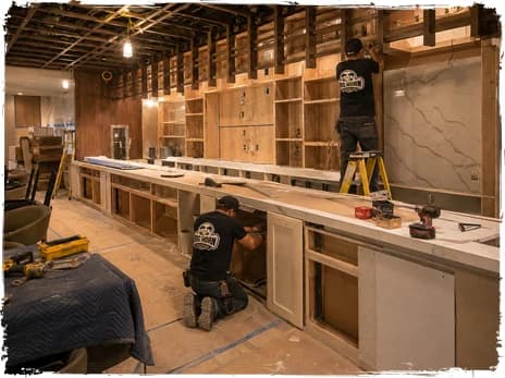 Contractors installing an unfinished restaurant bar and service counter