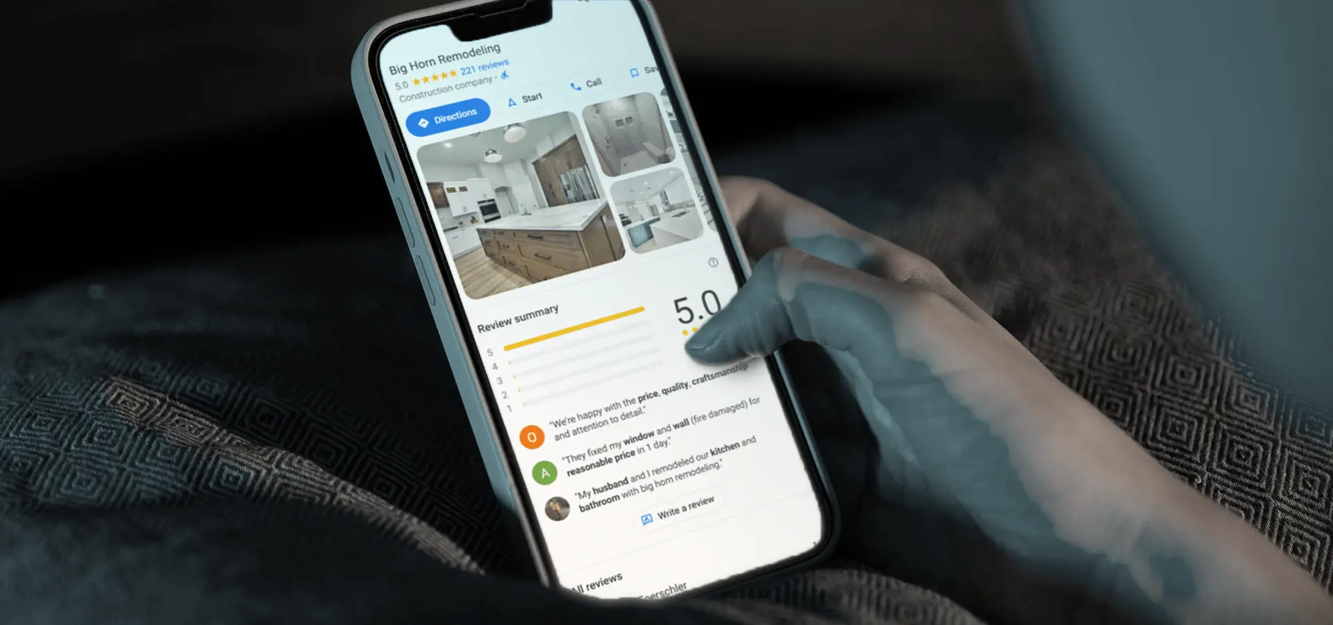 Customer viewing Big Horn Remodeling Google reviews on a phone