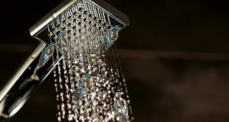 Water flowing from a square showerhead