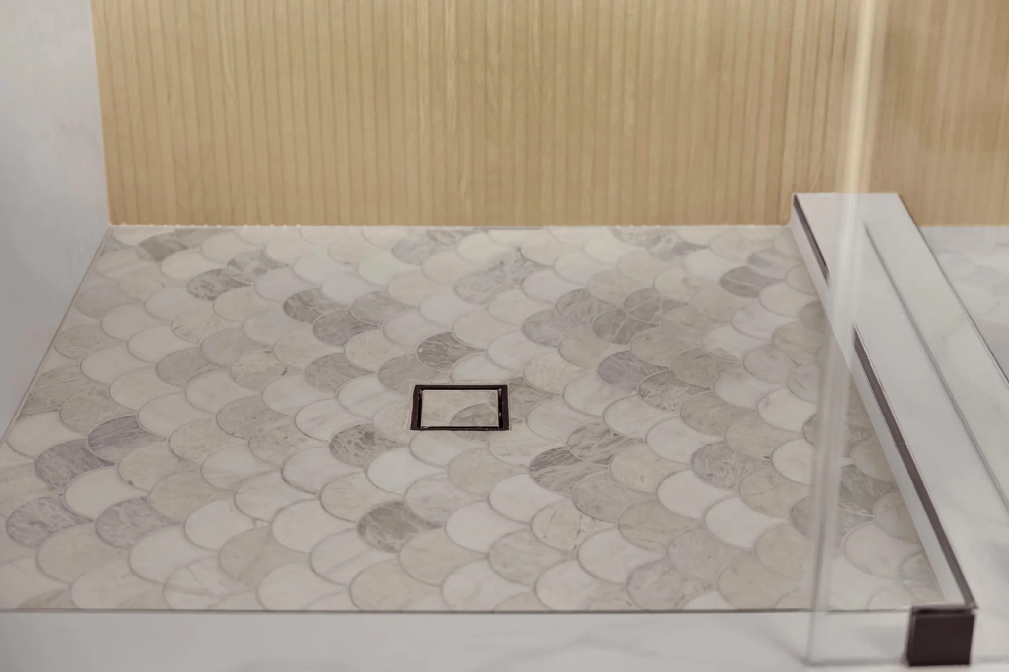 Freestanding tub addition in an upstairs primary bathroom with matte black tub filler and wet-area tile wall