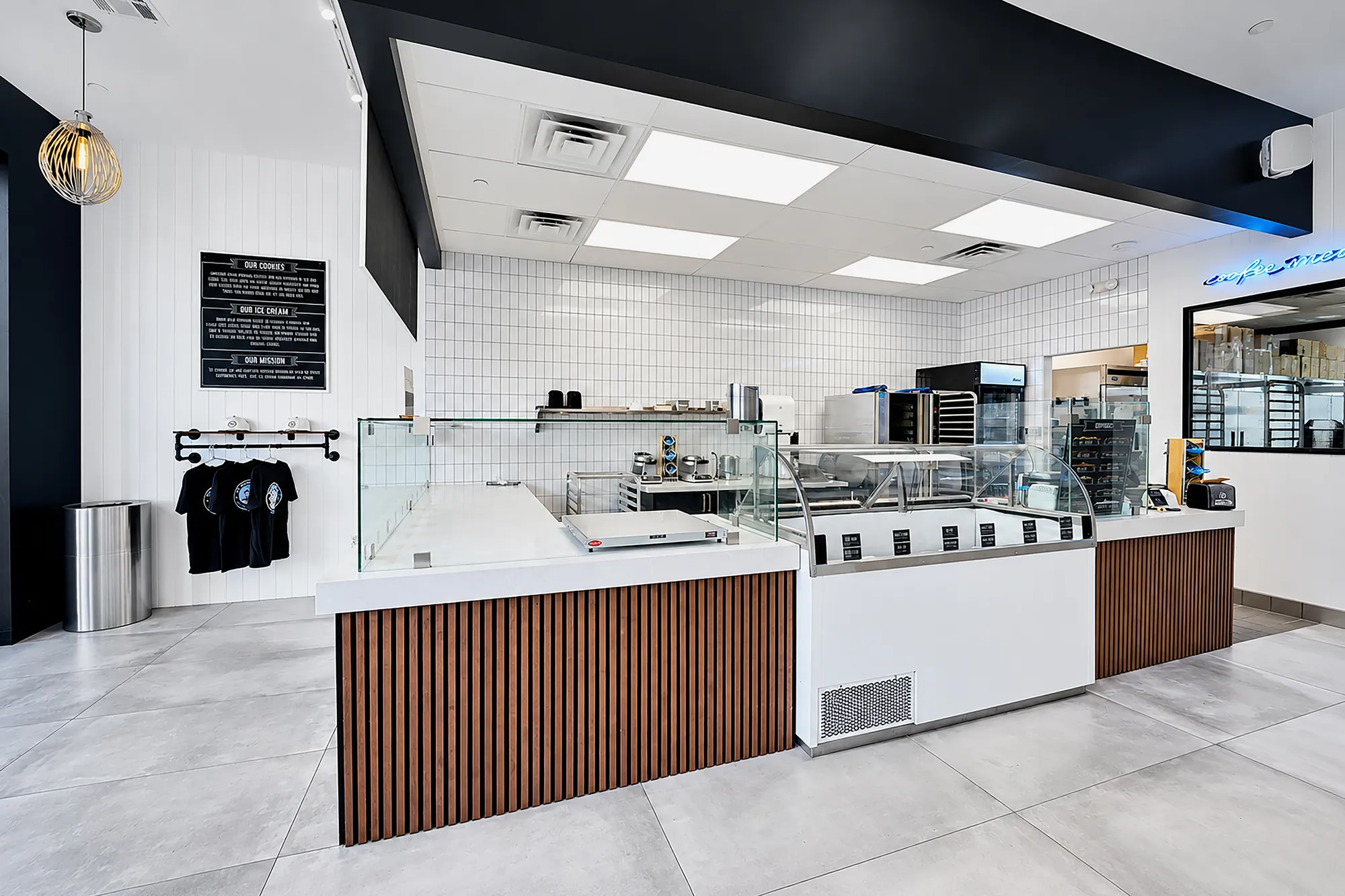 Ice cream dipping cabinet between wood-slat service counters at The Baked Bear in Las Vegas